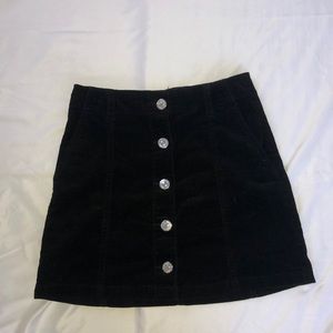 Black corduroy button front skirt
